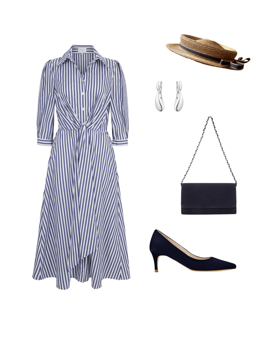 A model is wearing a blue and white striped shirt dress with a tied waist, complemented by a straw hat, silver earrings, and a navy clutch bag. On her feet are navy heels with a mid-height heel, made of leather. The background is a soft, neutral color, enhancing the outfit's elegance. image