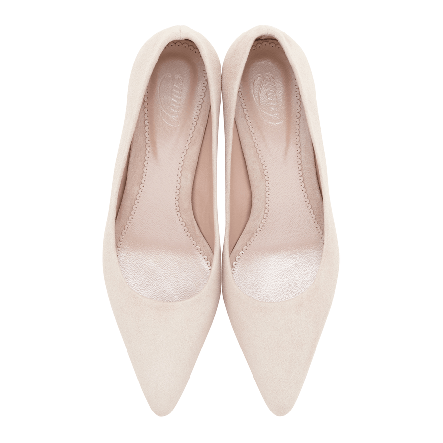 Pointed-toe pumps in a soft beige suede material, featuring a sleek design with a smooth interior. The shoes are displayed from a top-down angle against a clean white background, showcasing their elegant silhouette. image